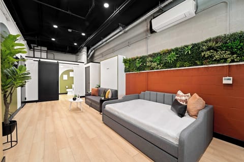 🌳 Soft seating tucked beneath greenery makes this the perfect place to pause.
