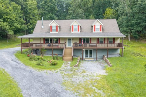 Private wooded retreat with wraparound porch and spacious driveway