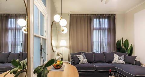 Cozy living room with chez lounge and dining table.