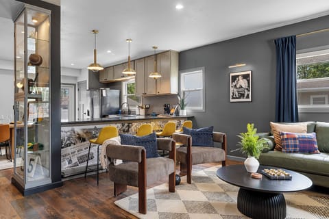 Spacious open-concept living, kitchen and dining area designed for gathering.