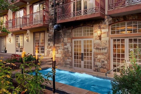 Soak in steamy waters while flames flicker beside you