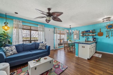 Bright, open-concept living space with comfortable seating and a fully equipped kitchen.