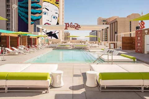 Dive into sun-soaked lounging with iconic rooftop pool views.