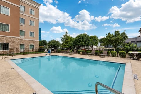 Take a dip in the seasonal outdoor pool with lounge chairs lined up along the fenced sundeck.