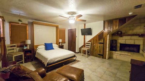 Recharge in Concan’s cozy queen-sized Murphy bed & stream your favorites on the smart TV​