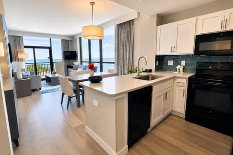 Wake up to ocean views!  Rare for Myrtle Beach, dramatic floor-to-ceiling windows fill this bright, open-concept condo with natural light and showcase the Atlantic from the kitchen, dining, and living areas.