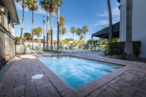 Cool off in a quieter pool corner with open-sky views.