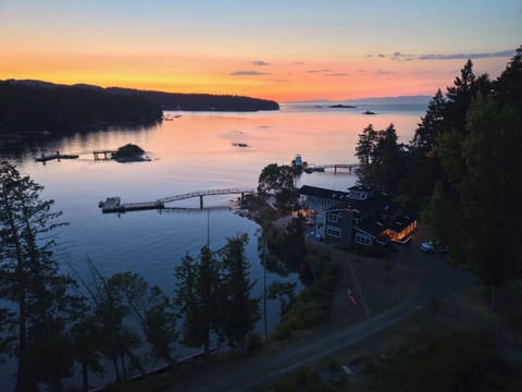 Spectacular sunset waterfront home with private dock and peaceful bay views