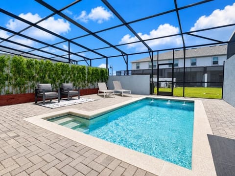 Private screened pool with spacious deck and comfortable outdoor seating.
