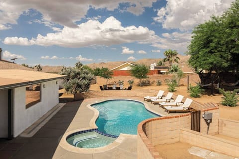 Private desert pool & spa with loungers and scenic mountain views
