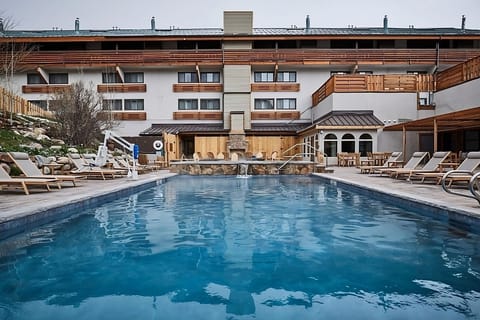 Arrive to a resort-style courtyard pool framed by mountain charm.