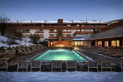Dive into a glowing evening pool after snowy mountain days.