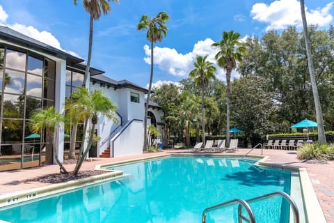 Dive into sparkling waters surrounded by tranquil tropical landscaping.