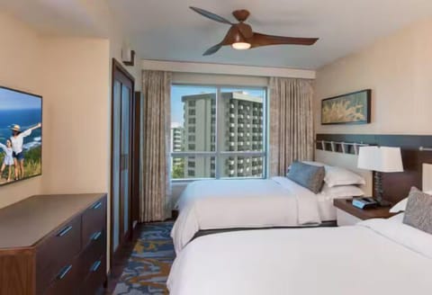 Bright double-queen room with city views, modern comforts, and natural light