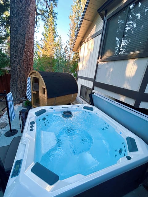 Private hot tub and barrel sauna nestled among the pines