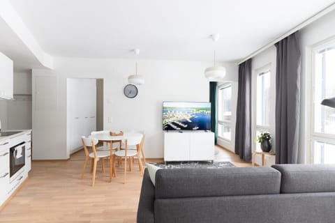 Open floor-plan combines the kitchen and living room into one space. Access to the balcony and both befrooms is from the living room