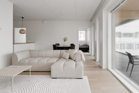 The loft-like layout combines the living room, kitchen & dining room