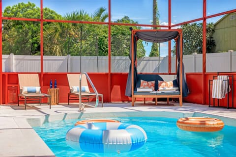 Dive into relaxation by the pool with cabana seating and vibrant decor!