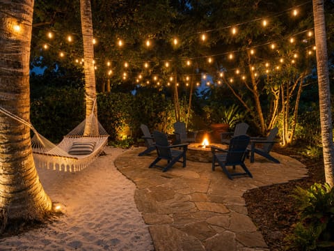 Private oasis, complete with a hammock, twinkling lights, and a fire pit.