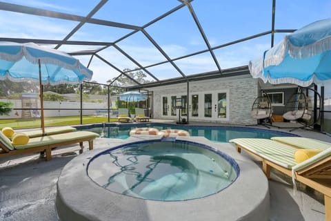 Backyard: Spend the day poolside in this spacious backyard with a refreshing swimming pool and inviting lounge area, perfect for relaxing, unwinding, and making the most of sunny weather.