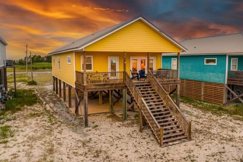 Your golden-hour escape awaits on this iconic yellow deck above the shore.