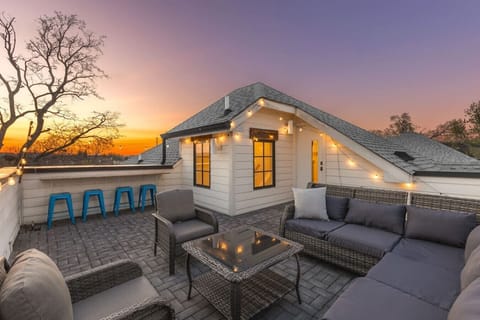 Private rooftop deck  with plenty of seating and outdoor lights, allowing you to enjoy your morning cup of coffee or a late night conversation while overlooking the skyline.