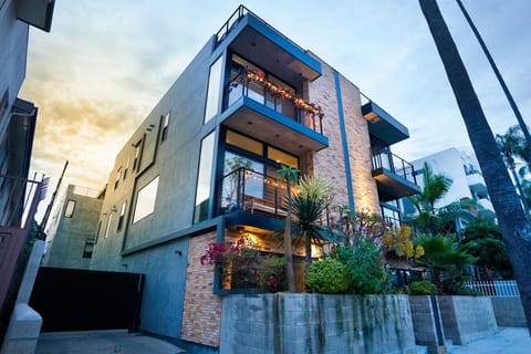 Modern townhome · Private entrance · Attached garage · Four-story home · Front garden · Balconies · Rooftop lounge · Full home sound system · Ring Alarm System