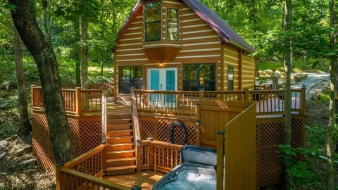 Front of house with view of hot tub