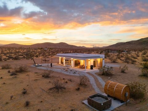 Welcome to Hoku Hale, your private desert retreat featuring panoramic mountain views, breathtaking sunsets, a hot tub, and a barrel sauna.