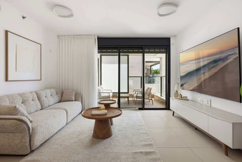 Unwind on the plush lounge sofa while watching movie favorites on a large television.