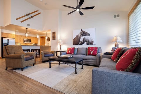 Settle into your spacious alpine retreat featuring vaulted ceilings, cozy seating for gatherings, a full kitchen ready for your meals, and rustic ski-lodge charm throughout.