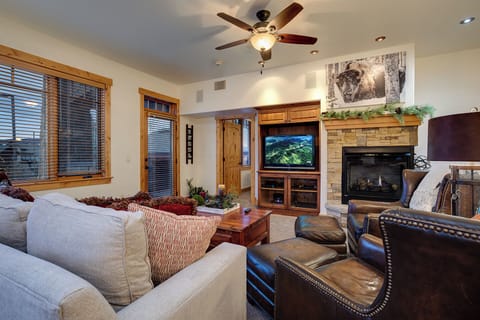 Settle into plush seating and unwind by the warmth of your fireplace, where cozy mountain evenings become your perfect retreat with entertainment at your fingertips.