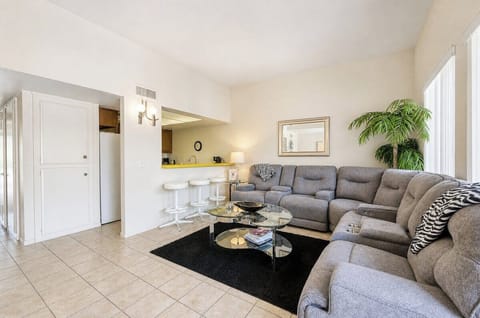 Sink into the plush sectional sofa and unwind in your bright, open living space—perfect for relaxing after a day of adventure.