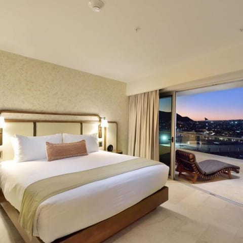 Elegant king bedroom with private terrace and stunning city views