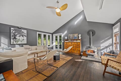 Cozy living room with large sectional, working fireplace, movie projector, sound