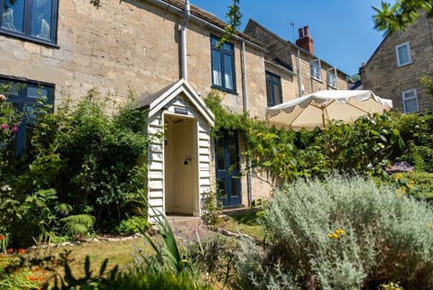 Follow the sunny garden path under the parasol into Hazel Cottage