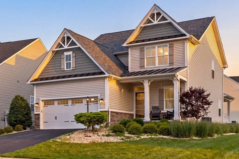 Wings of Steel welcomes you home at twilight, with warm lighting and a covered front porch.