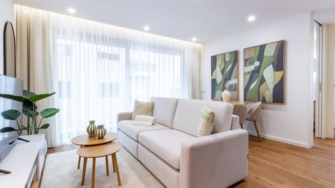 Relax in the spacious living area, bathed in natural light, where comfortable seating and contemporary decor create a welcoming atmosphere for unwinding. Step out onto the balcony for a breath of fresh air. #SpaciousLiving #NaturalLight #ModernDecor #Balc