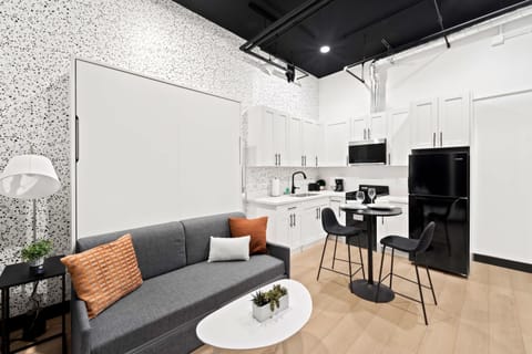 🌃 A stylish city loft—sleek black accents and an open layout make every square foot count.