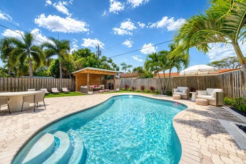 Outdoor oasis. Pool, Furnished Cabana, Weber Grill, Turf, Outdoor Shower, Loungers, Dining table and more