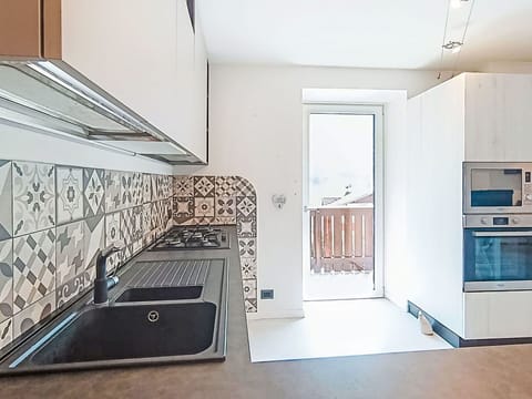 Kitchen, Countertop, Interior Design, Flooring, Wood, Kitchen Appliance, Cabinetry, Floor, Architecture, Major Appliance