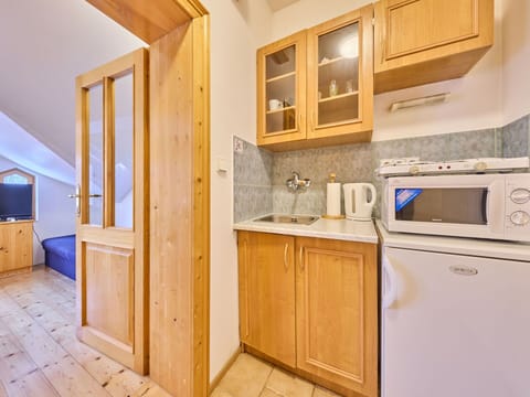 Cabinetry, Property, Furniture, Countertop, Building, Kitchen Appliance, Blue, Wood, Kitchen Stove, Interior Design