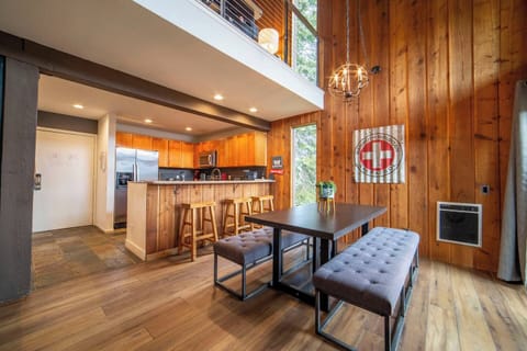 Enjoy the open concept dining and living room with comfy bench seating for 6, and bistro kitchen seating for 3. 