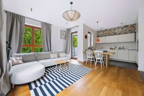 Living room with a sofa and Smart TV | Book now with Rentujemy