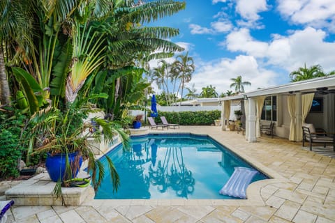 Enjoy a refreshing swim in the private pool surrounded by a beautifully landscaped backyard.