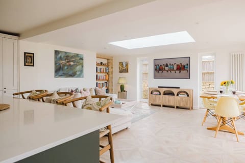 Cook, socialise, relax and dine all in one bright, airy space with bifold doors that being the outside in
