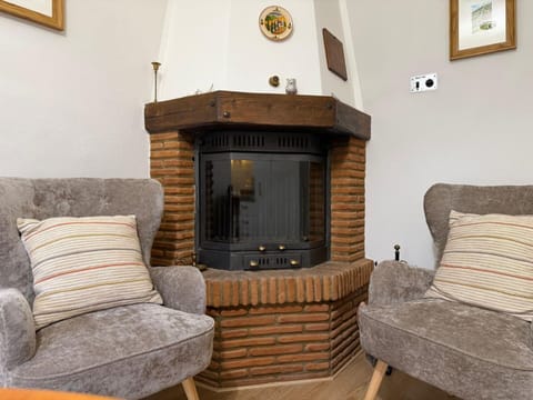 Furniture, Interior Design, Wood, Flooring, Floor, Room, Living Room, Hearth, Lighting, Couch