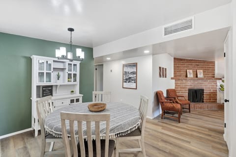 Gather & Dine: Cozy dining table with seating for four, perfect for home-cooked meals or takeout.