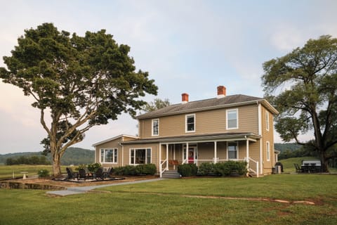 The main farmhouse under the old oak