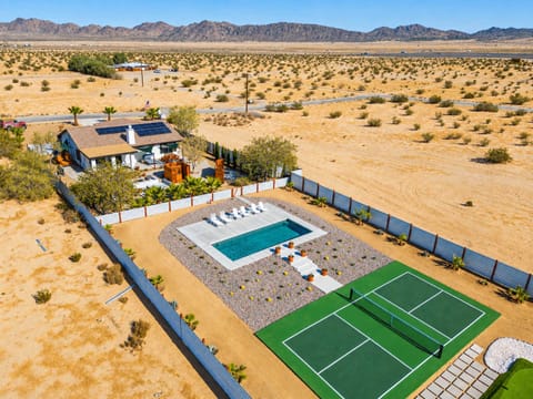 Welcome to Sun Mesa Sanctuary - your amenity-filled escape in the desert! Featuring mini golf, pickleball, pool, hot tub, outdoor shower, outdoor bathtubs and more!